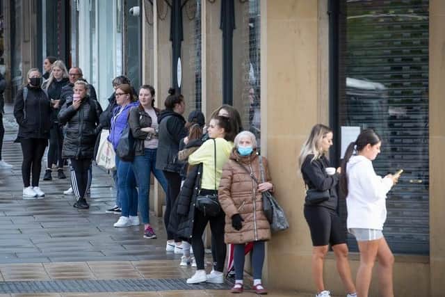Shoppers queue up outside Primark as non-essential retail reopens across Edinburgh for the first time in months
