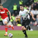 Macauley Bonne in action for Charlton Athletic against Eiran Cashin of Derby during a League One clash at Pride Park in February