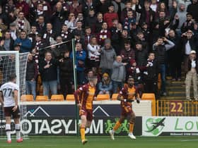 A disgruntled Hearts support watches on after Jonathan Obika opened the scoring for Motherwell. Picture: SNS