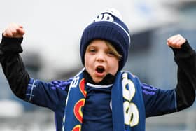 A young Scotland fan on his way to Hampden Park to see Scotland beat Spain 2-0