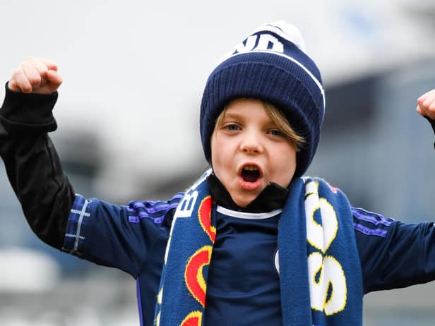 A young Scotland fan on his way to Hampden Park to see Scotland beat Spain 2-0