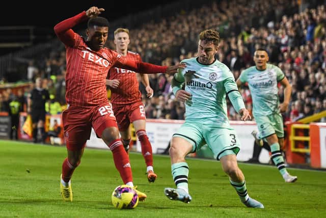 Aberdeen's Jayden Richardson is closed down by Hibs wing-back Marijan Cabraja at Pittodrie. Picture: Craig Foy / SNS