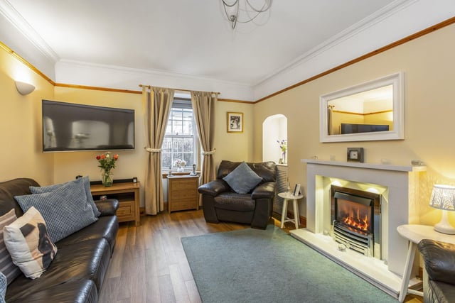The property's large lounge with feature fireplace and ample room for freestanding furniture.