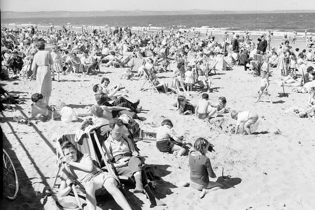 Crowds sunbathing on Portobello Beach in June 1957.