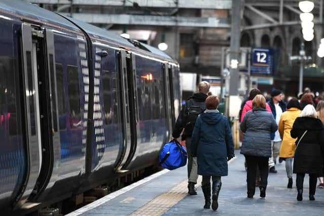 Ticket examiners operate on most trains in and around Glasgow. Picture: John Devlin