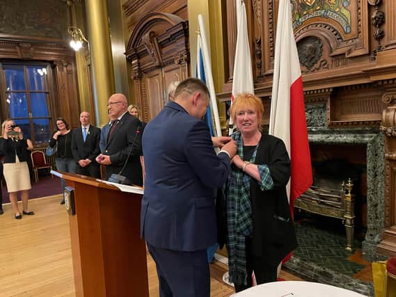 Christine Grahame receives a medal from the Polish consul at a reception in Edinburgh City Chambers marking Poland’s National Constitution Day