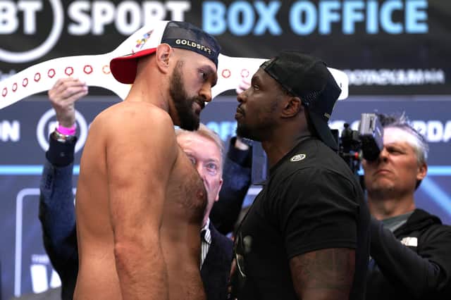 Tyson Fury (left) and Dillian Whyte face off during the weigh in at BOXPARK Wembley, London.