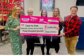 Radio Forth and Cash for Kids charity staff with the £3,000 cheque received from Itihaas and Radhuni.