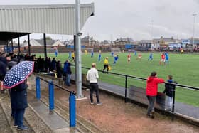 Supporters take cover on a dreich day at  Newtown Park, where visitors Bonnyrigg Rose edged out Bo’ness United to stay one point clear at the top of the Lowland League