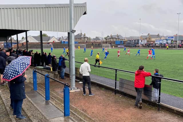 Supporters take cover on a dreich day at  Newtown Park, where visitors Bonnyrigg Rose edged out Bo’ness United to stay one point clear at the top of the Lowland League