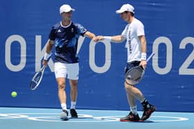 The fist bump - as seen here between Andy Murray and Joe Salisbury at Tokyo 2020 -  has become an everyday greeting amid the pandemic and John McLellan doesn't want to see it go. PIC: Getty.
