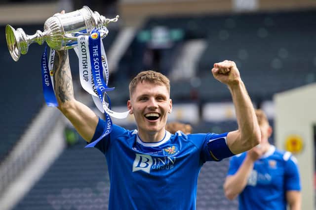 GLASGOW, SCOTLAND - MAY 22: St Johnstone Captain Jason Kerr lifts the Scottish Cup trophy  during the Scottish Cup final match between Hibernian and St Johnstone at Hampden Park, on May 22, 2021, in Glasgow, Scotland. (Photo by Craig Williamson / SNS Group)