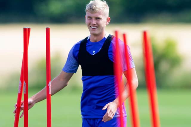 Hibs defender Josh Doig remains all smiles in training despite transfer distraction. Photo by Mark Scates / SNS Group