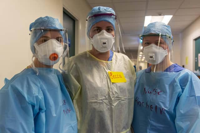 Doctors and nurses prepare to enter the Covid-19 ward putting on the PPE safety equipment at the Edinburgh Royal Infirmary. Picture: Andy O'Brien