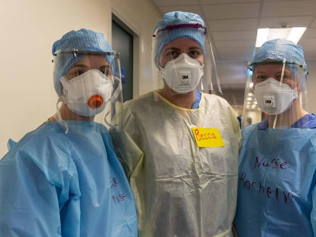 Doctors and nurses prepare to enter the Covid-19 ward putting on the PPE safety equipment at the Edinburgh Royal Infirmary. Picture: Andy O'Brien