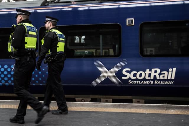 British Transport Police officers are appealing for information after a man sexually assaulted a woman on board a train from Glasgow to Edinburgh.