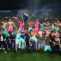 Hellas Verona and Josh Doig, front row centre, celebrate Serie A survival