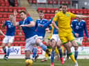 Hibs' Paul McGinn and St Johnstone's Liam Craig in action during Saturday's league match at McDiarmid Park. Photo by Alan Harvey / SNS Group
