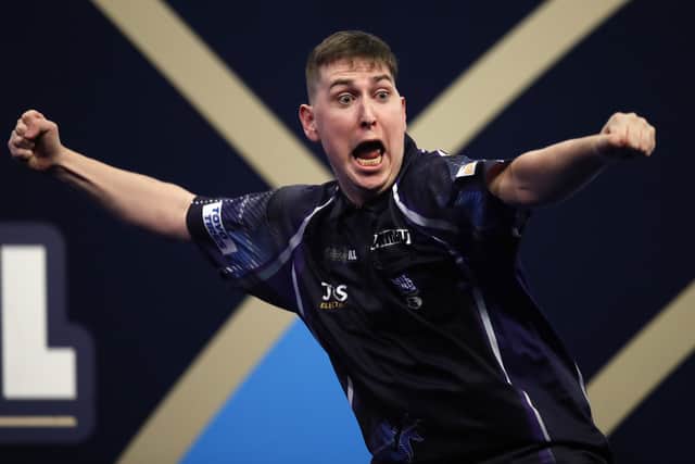 William Borland of East Calder reacts to his stunning nine-dart finish during his first round match