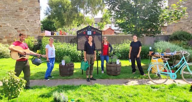 Some of the volunteers at Roslin Community Garden with the planters.