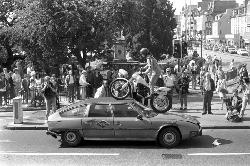 Controversial French circus Archaos drive a motorbike over a car on Waverley Bridge as a publicity stunt for their Edinburgh Festival Fringe show in August 1989.