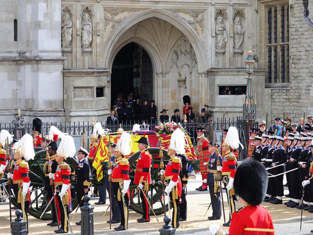 Prince William, Prince of Wales, Prince Richard, Duke of Gloucester, King Charles III, Prince Harry, Duke of Sussex, Vice Admiral Sir Timothy Laurence, Anne, Princess Royal and Prince Andrew, Duke of York watch on as The Queen's funeral cortege borne on the State Gun Carriage of the Royal Navy as it departs Westminster Abbey (Photo by Chris Jackson/Getty Images)