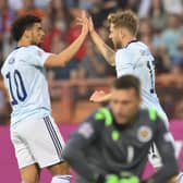 Scotland ace Stuart Armstrong, right, celebrates with Che Adams after scoring his side's first goal during the Nations League clash against Armenia. Picture: AP