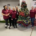 A group of Hearts fans volunteering at the Stadium to wrap up and prepare Christmas gifts deliveries. Picture: Contributed
