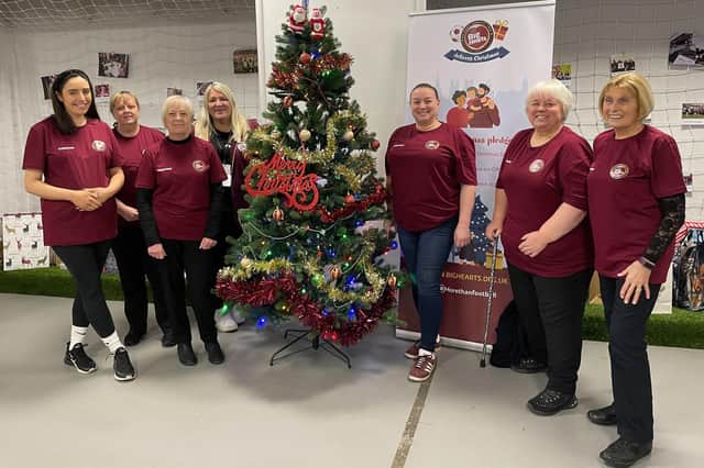 A group of Hearts fans volunteering at the Stadium to wrap up and prepare Christmas gifts deliveries. Picture: Contributed