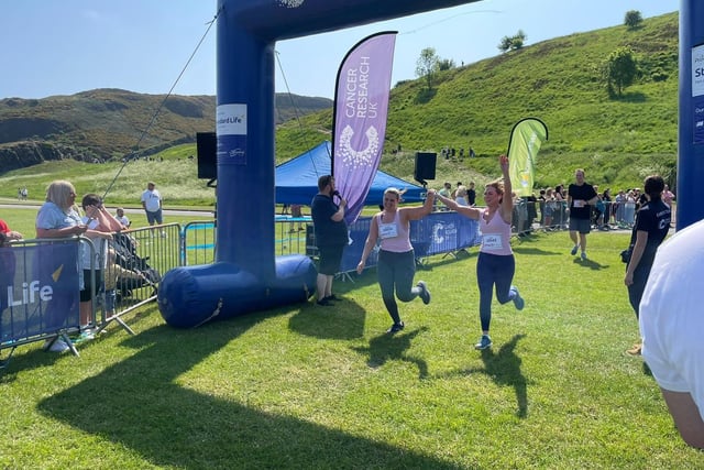 This pair were all smiles as they crossed the finish line in Holyrood Park on Sunday.