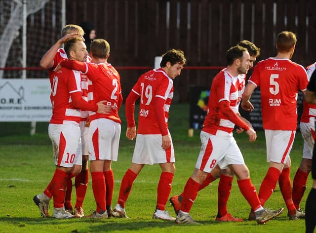 Bonnyrigg Rose's Lee Currie is congratulated by his team-mates at New Dundas Park. Pic: Michael Gillen