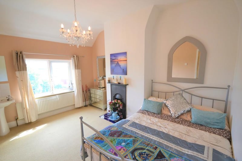 Bedroom - This is a rear facing good sized double bedroom enjoying pleasant farmland views from a UPVC double glazed window,  a decorative feature cast iron fireplace with tiled hearth and a useful wash basin with pedestal to one corner.