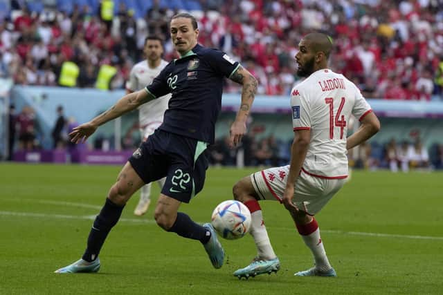 Australia's Jackson Irvine, left, and Tunisia's Aissa Laidouni challenge for the ball during the World Cup group D match. Picture: Ricardo Mazalan/AP