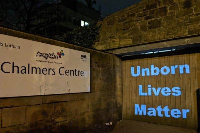 Pro life images projected onto clinic