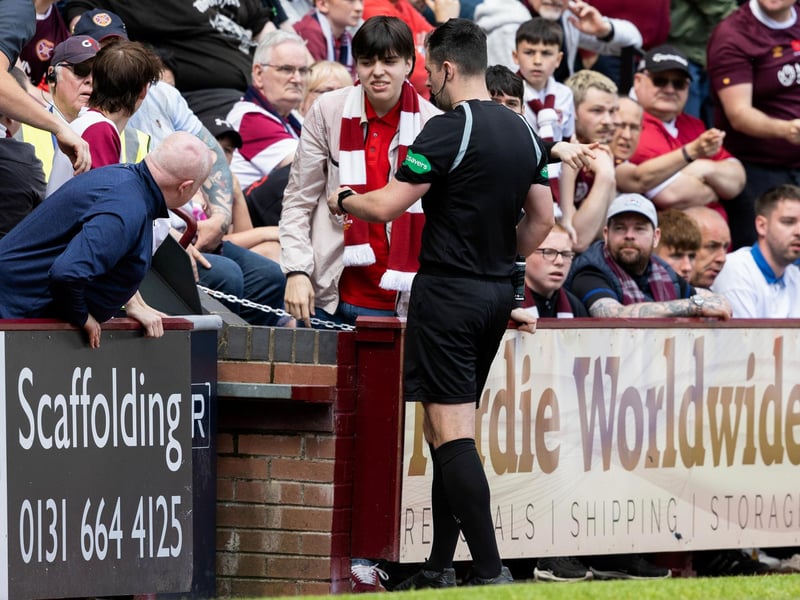 Referee Don Robertson check the VAR screen before sending Cochrane off for denying a goal scoring opportunity
