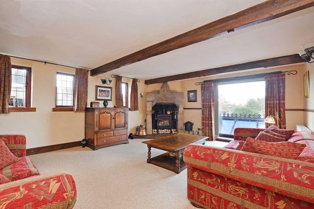 The principal reception room is the lounge, which features a log burner within a stone surround.