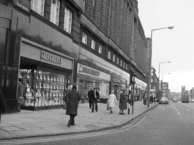 Shops (including Woolworths and Jeffreys household furnishings) at the top of Lothian Road Edinburgh in December 1974.