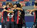 Aaron Hickey, right, joins in the celebrations after Roberto Soriano opens the scoring for Bologna. Picture: Getty
