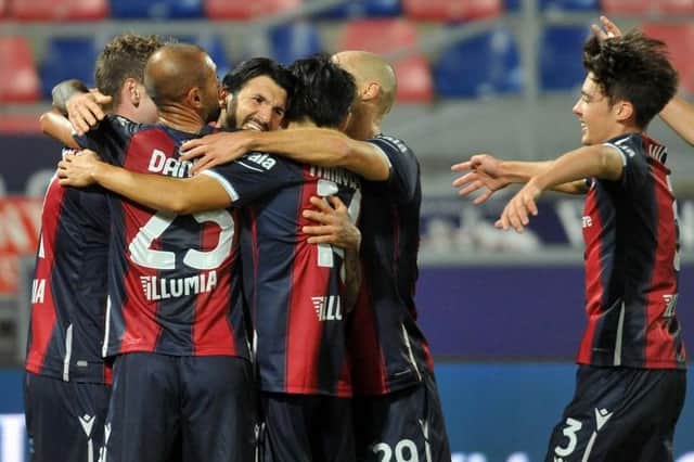 Aaron Hickey, right, joins in the celebrations after Roberto Soriano opens the scoring for Bologna. Picture: Getty