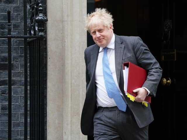 Prime Minister Boris Johnson said MPs should wear the sanctions as a "badge of honour".