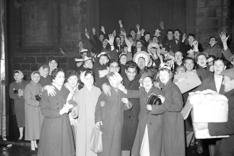 Hogmanay 1959: Revellers see in the new year outside the Tron Kirk, the traditional venue for the bells.