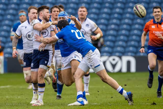 Substitute scrum-half Ali Price plays the pass under pressure to set up Duhan van der Merwe for Scotland's final try against Italy. Picture: Craig Williamson/SNS