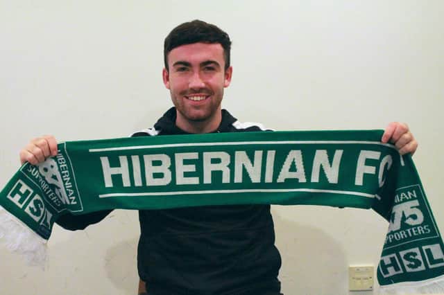 Hibs midfielder Stevie Mallan with a Hibernian Supporters Limited scarf. Pic: HSL