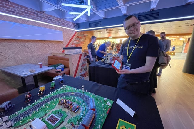 Jamie Ellis with his 'Little Train of Wales' model which uses a special software to make the train stop, start, speed up and slow down at different parts of the track.