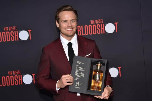 Sam Heughan talks all things whisky in the latest episode of our food and drink podcast, Scran. (Photo by CHRIS DELMAS/AFP via Getty Images)