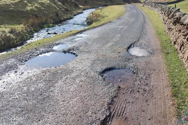 Pot holes on the way to Loganlea Fishery. Picture: Nigel Duncan