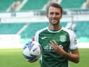 Christian Doidge celebrates with the match ball after netting a hat-trick against Clyde