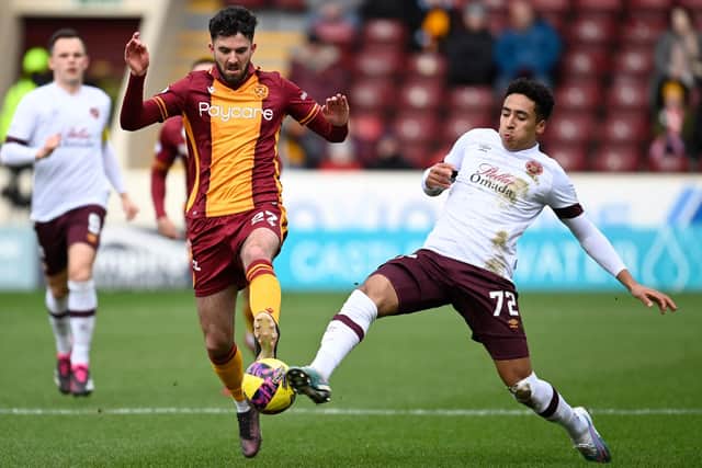 James Hill tries to tackle Motherwell's Sean Goss during Hearts' 2-0 defeat at Fir Park last weekend. Picture: SNS