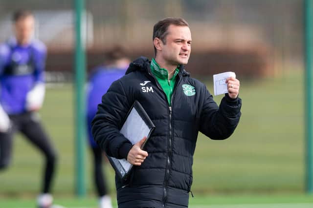Shaun Maloney delivers instructions to his Hibs team on the training ground