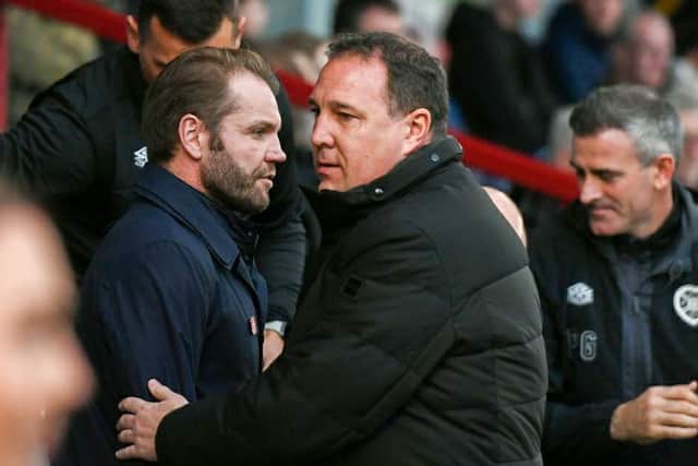 Ross County manager Malky Mackay with Hearts manager Robbie Neilson in Dingwall.